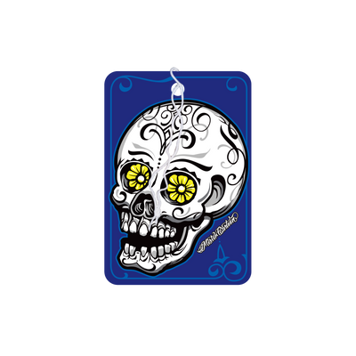 Midnight-scented air freshener. Sugar skull design with yellow flower eyes on a blue background. Midnight-scented air freshener. Sugar skull design with yellow flower eyes on a blue background.