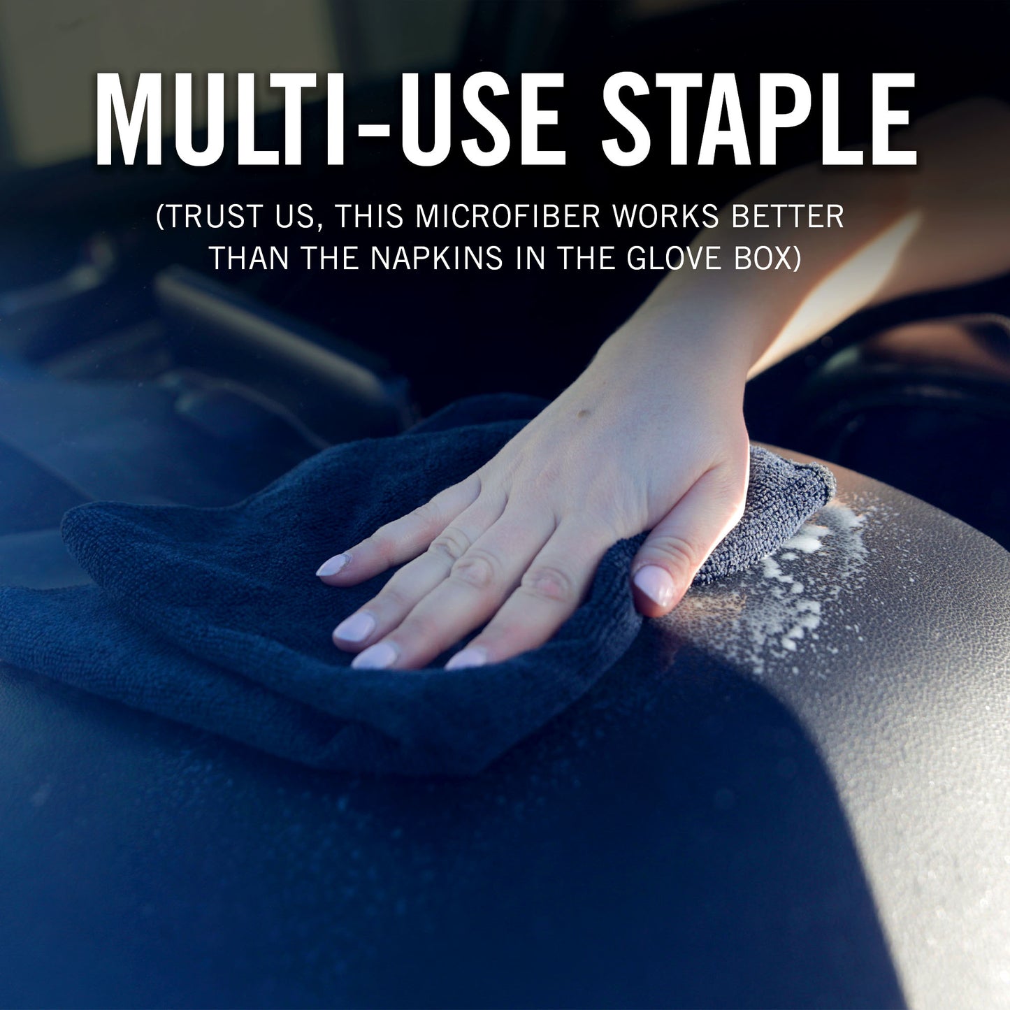 Hand using a Black microfiber cloth to clean a surface, with text highlighting its effectiveness.