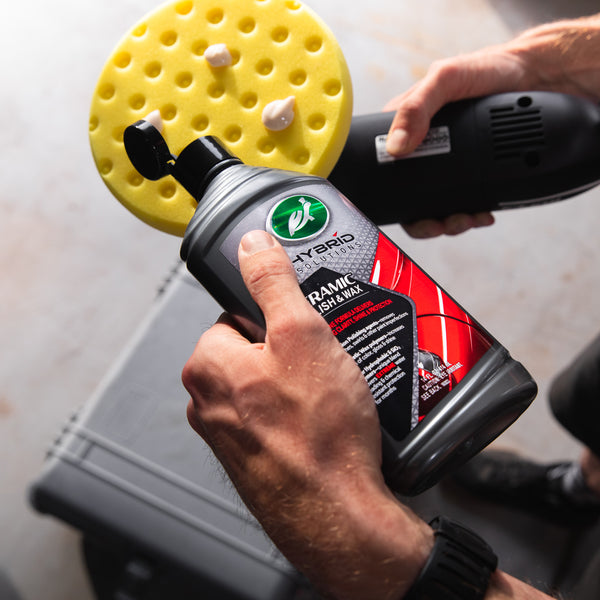 Applying Turtle Wax Ceramic Polish & Wax to a polishing pad. Great for car detailing. Hybrid Solutions for auto surface care.