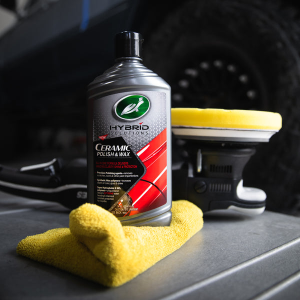 Turtle Wax Hybrid Solutions ceramic polish, applicator and microfiber towel for automotive detailing.