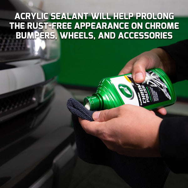 Hands apply Turtle Wax Chrome Polish & Rust Remover to a cloth. Image features an automobile and chrome detail.