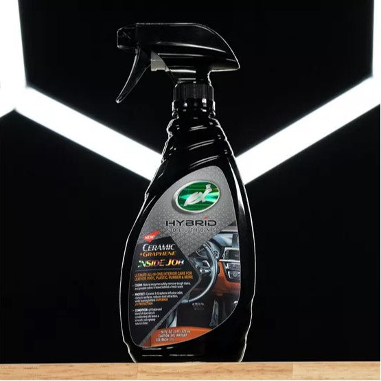Turtle Wax Hybrid Solutions Ceramic + Graphene Inside Job interior car cleaner spray bottle on a counter.