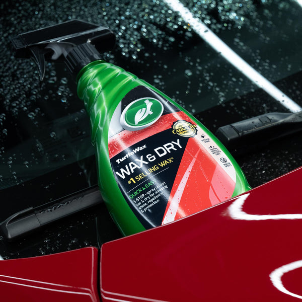 Turtle Wax & Dry spray on wet car, showing Carnauba for shine and water repellency. Easy 1-step application for auto detailing.