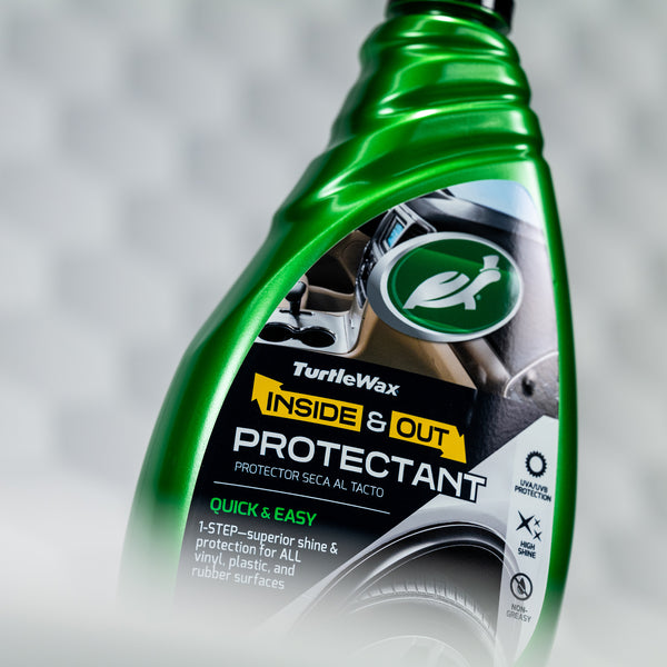 Hero shot of Inside and Out Protectant bottle placed on vehicle surface.