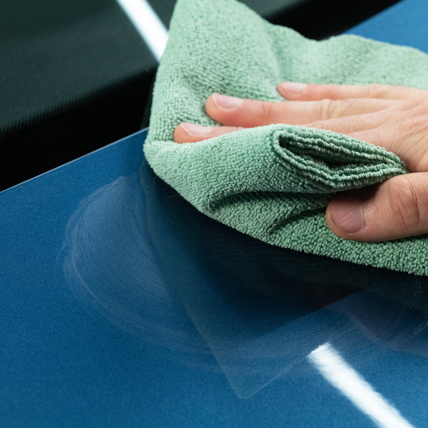 Hand buffing auto paint with Turtle Wax compound. Removing swirls and restoring shine.