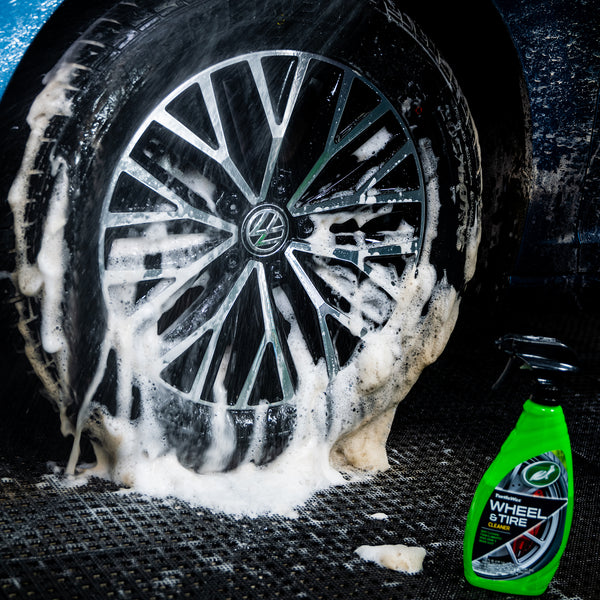 Zoomed view of tire detailing process highlighting foamy action of Wheel and Tire Cleaner.