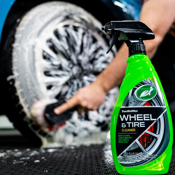 Close-up of foam and grime lifting off a wheel using Turtle Wax Wheel and Tire Cleaner.