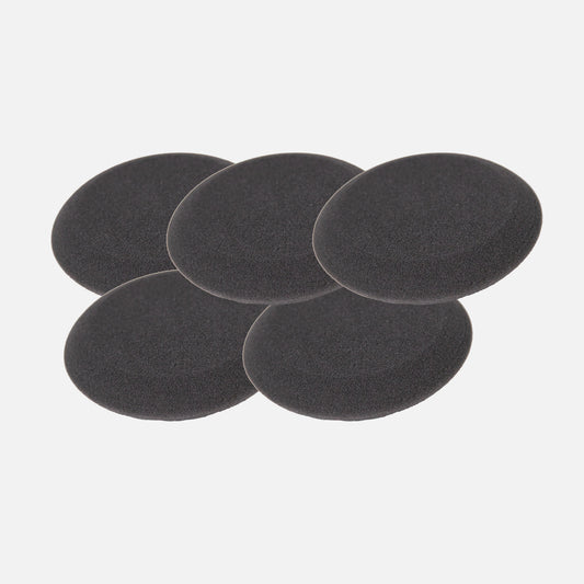 Five black, round, porous foam pads for car detailing are stacked on a white background.