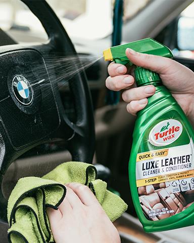 Detailing a BMW steering wheel with Turtle Wax Luxe Leather Cleaner & Conditioner. Car interior care.