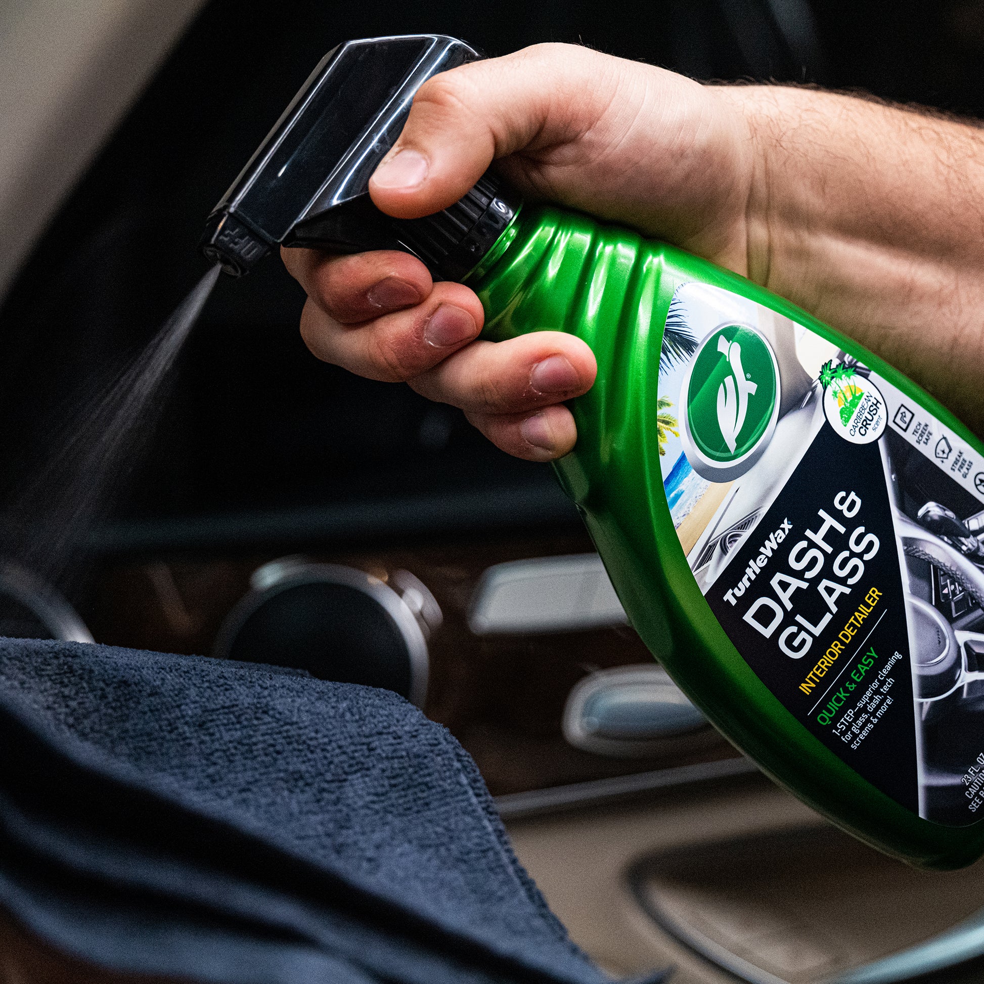 Turtle Wax dash cleaner sprayed on car interior. This auto detailing spray cleans glass and plastic surfaces, leaves a streak-free finish.