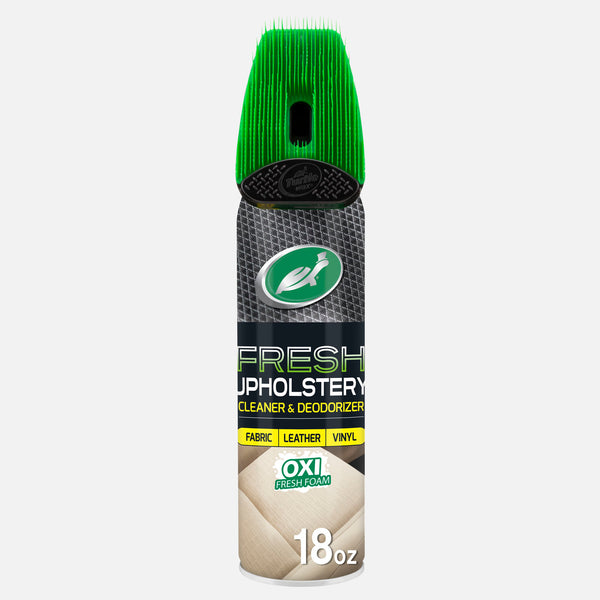 Turtle Wax Upholstery Cleaner, carpet and fabric stain and odor eliminator. It has a green brush-top applicator for car interiors.