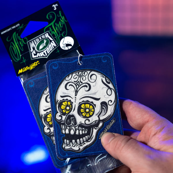 Detail shot of the air freshener from the 'Midnight' line, with stylized branding elements.