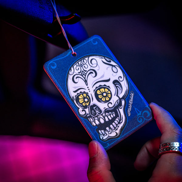 Product-on-display image of the 'Midnight' air freshener inside a dark-colored car.