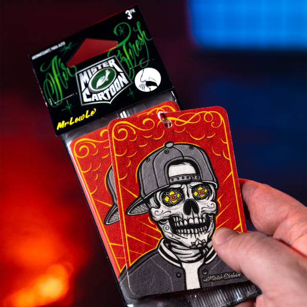Studio image of the 'Mr. Low-Lo' air freshener hanging in a vintage lowrider interior.