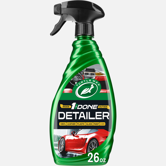 Green spray bottle of Turtle Wax 1& Done car detailing product on a white background