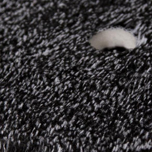 Close up of a 50/50 microfiber detailing pad. Dense black & white fibers. Excellent car care.