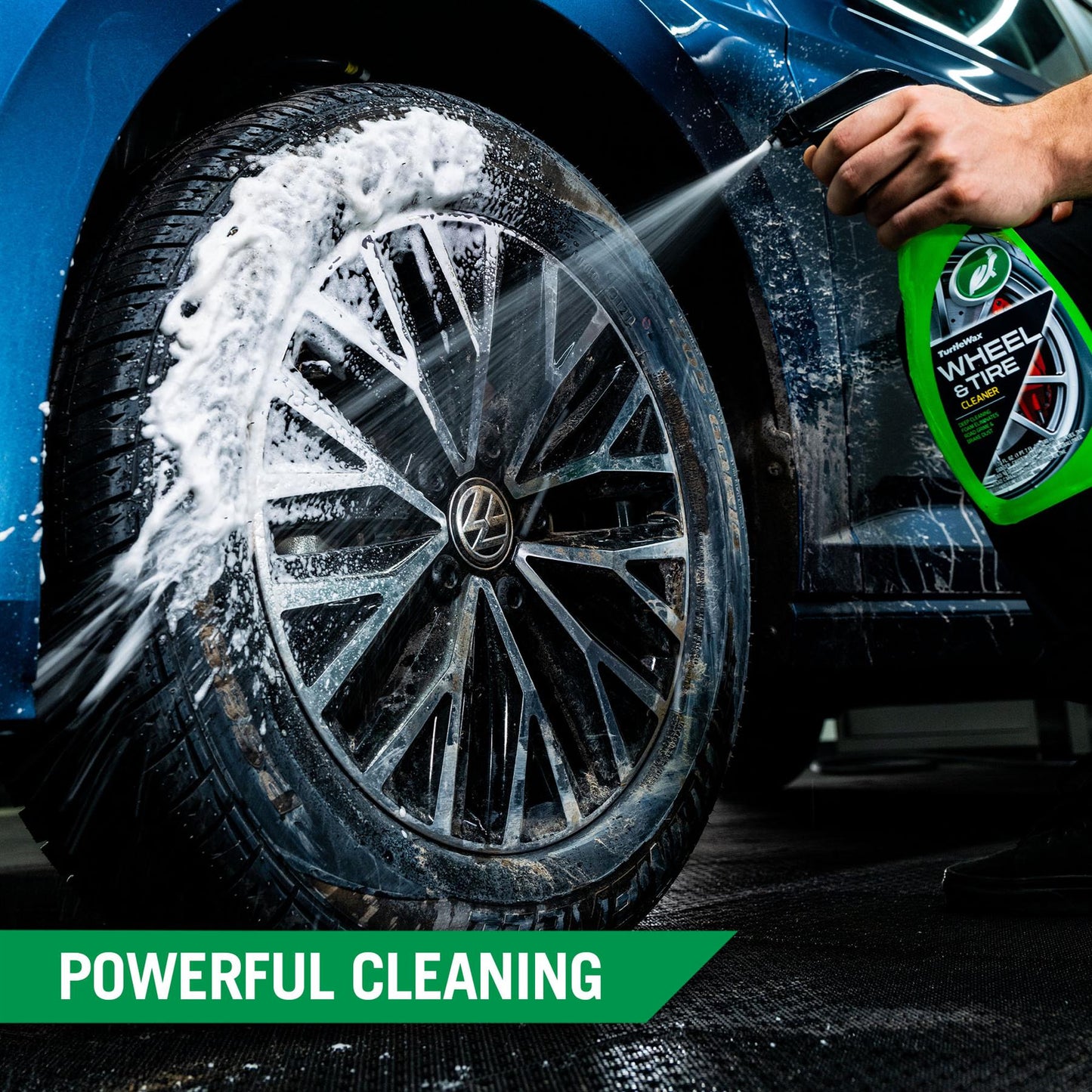 Turtle Wax Wheel & Tire Cleaner sprays foam on a dirty car wheel & tire. Detail cleaning for road grime and brake dust removal.