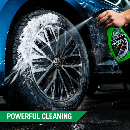 Turtle Wax Wheel & Tire Cleaner sprays foam on a dirty car wheel & tire. Detail cleaning for road grime and brake dust removal.