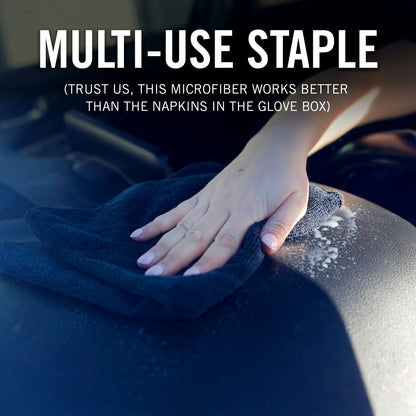 Hand using a Black microfiber cloth to clean a surface, with text highlighting its effectiveness.