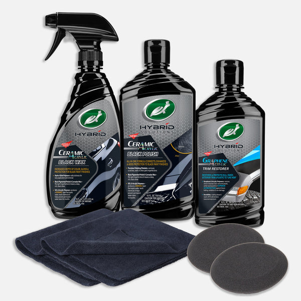 Turtle Wax kit for black car care: ceramic wax, polish, and graphene trim restorer with applicator pads & cloths for auto detailing.
