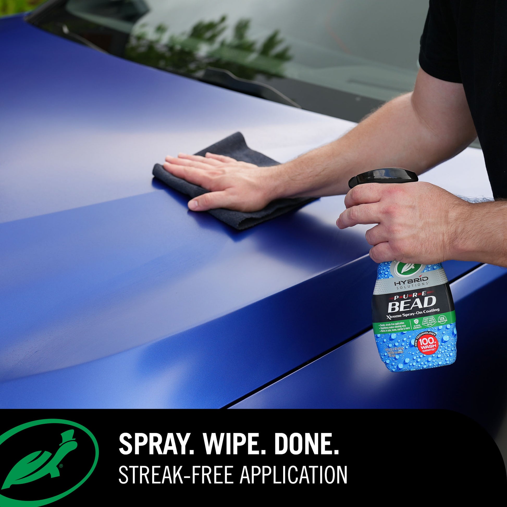 Person cleaning a car with a spray and cloth, featuring a bottle labeled 'Hydro Bead'.