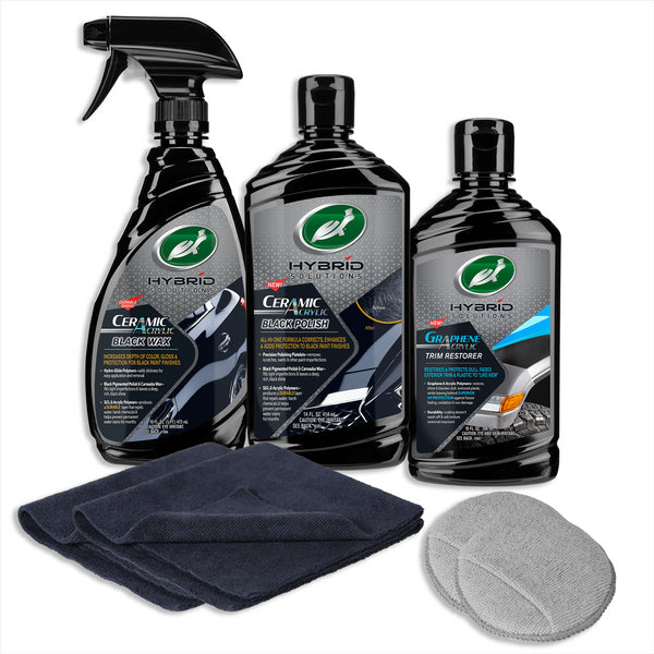Turtle Wax Ceramic Acrylic Black Polish, Black Wax, and Graphene Acrylic Trim Restorer are shown with a white background alongside two microfiber towels and two applicator pads. 
