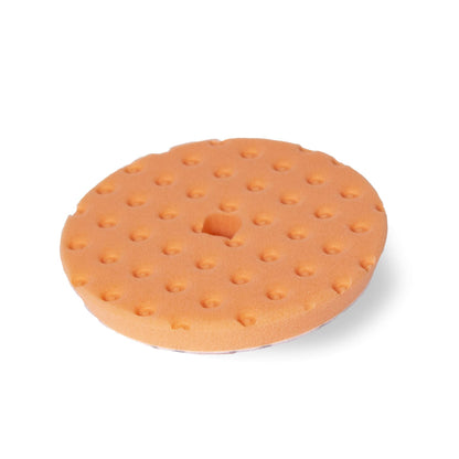 Round orange foam pad with CCS technology for auto paint correction.