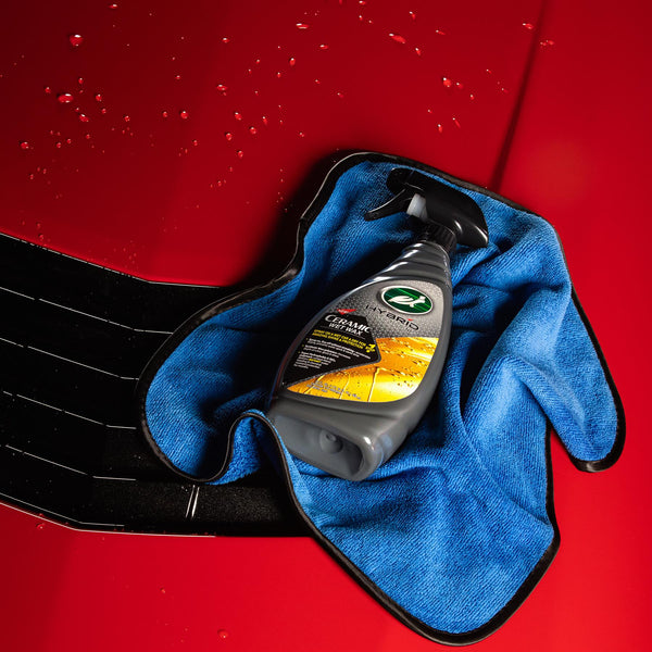 Front-facing shot of Turtle Wax Ice Seal N Shine spray bottle with sleek black and red label design.