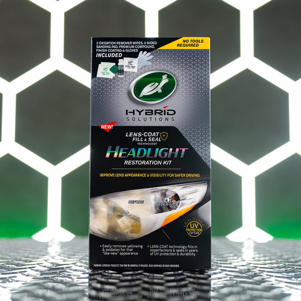 Image showing streak-free glossy finish on a vehicle panel with mirror-like reflections after product use.