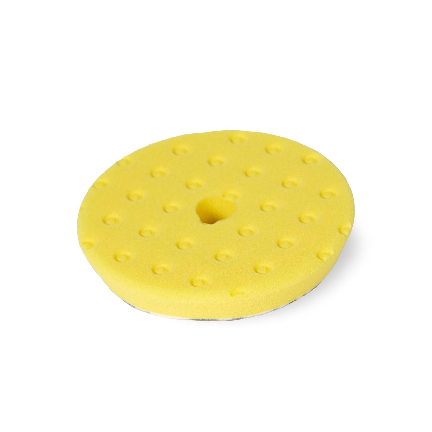 Round yellow polishing pad features a CCS technology design with cut-outs and center hole.