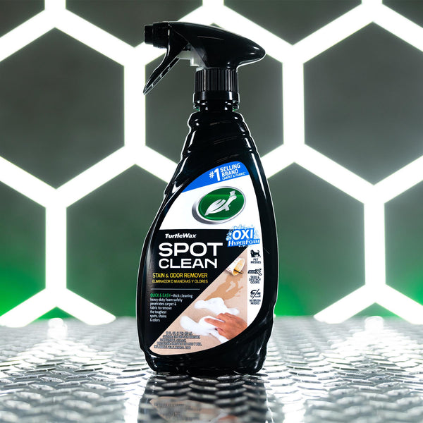 A lifestyle image of Spot Clean against a hexagon patterned background