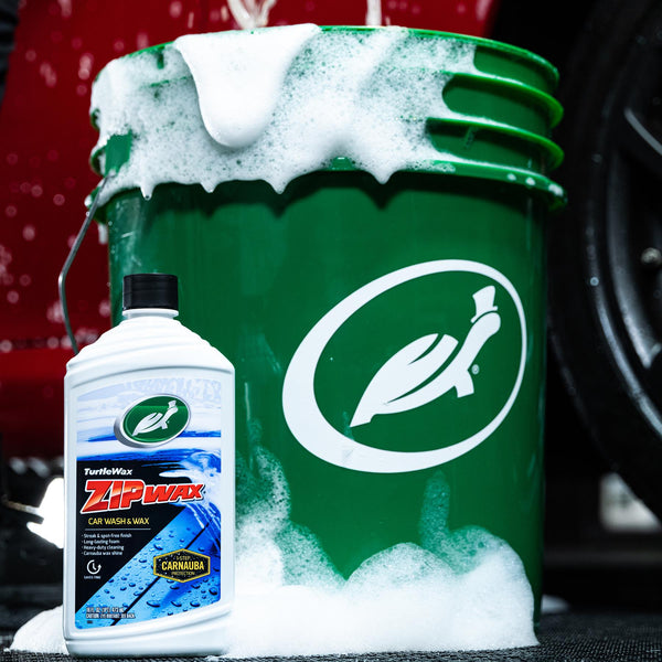 Product-only shot of Zip Wax Car Wash container against white background, clear focus on label text and color branding.